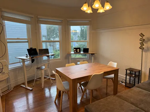 Unit 2332: shared area with standing desks and the big table