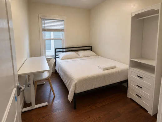 Another room, with a tall closet and the desk at the window