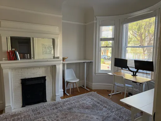 Unit 550: shared space, standing desks in the bay window