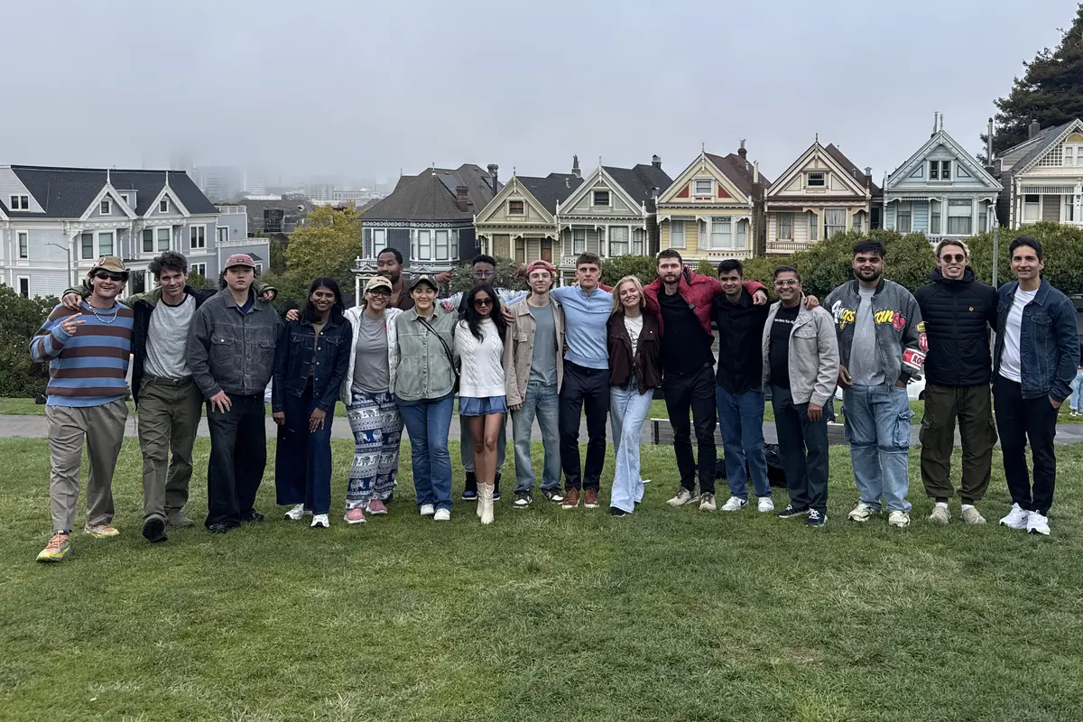 Foundry residents together on the lawn at Alamo Square, with the Painted Ladies behind them